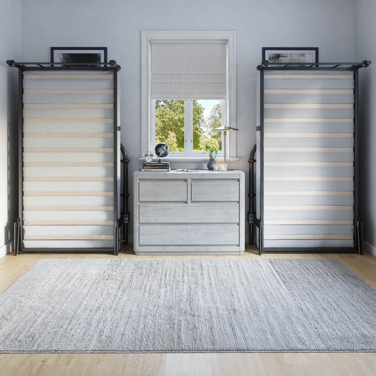 Room with gray walls, a window with blinds, and two black metal twin beds lifted up against the wall.