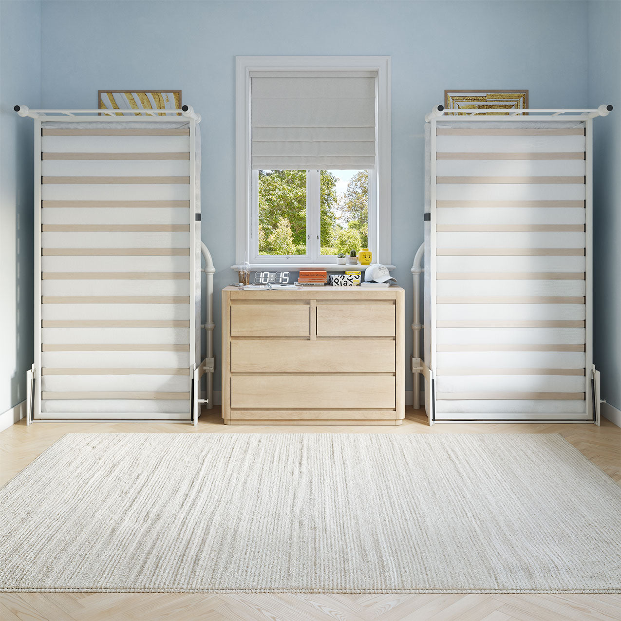 the room has a dresser, mirror, and two liftable beds up against a light blue wall.