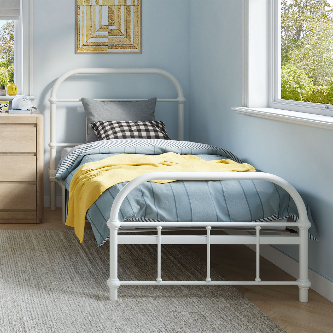 White metal bed with blue bedding and yellow blanket in a room with light blue walls and a window.
bed frame with headboard footboard lift bed storage lift up bedroom furniture risers space-saving black metal