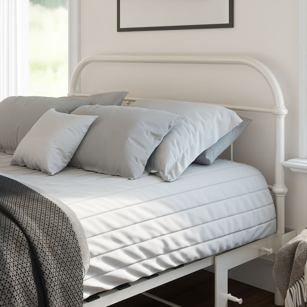 Bed with gray bedding and a knitted blanket in a bright room.bed frame with headboard footboard lift bed storage lift up bedroom furniture risers space-saving white metal