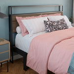Bed with pink and white bedding in a bedroom settingbed frame shelf headboard footboard walnut charger charging station panel mahogany black brown bedroom furniture
