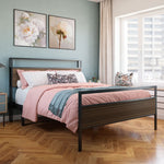 Bedroom with a bed featuring pink bedding and floral pillows, wooden floor, and light blue walls.bed frame shelf headboard footboard walnut charger charging station panel mahogany black brown bedroom furniture