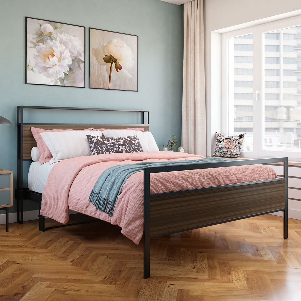 Bedroom with a bed featuring pink bedding and floral pillows, wooden floor, and light blue walls.bed frame shelf headboard footboard walnut charger charging station panel mahogany black brown bedroom furniture