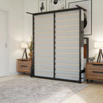 Room with a foldable bed lifted up against the wall with two wooden nightstands and a grey rug