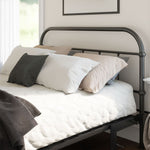 Bed with black metal frame and pillows in a room.
bed frame with headboard footboard lift bed storage lift up bedroom furniture risers space-saving black metal 