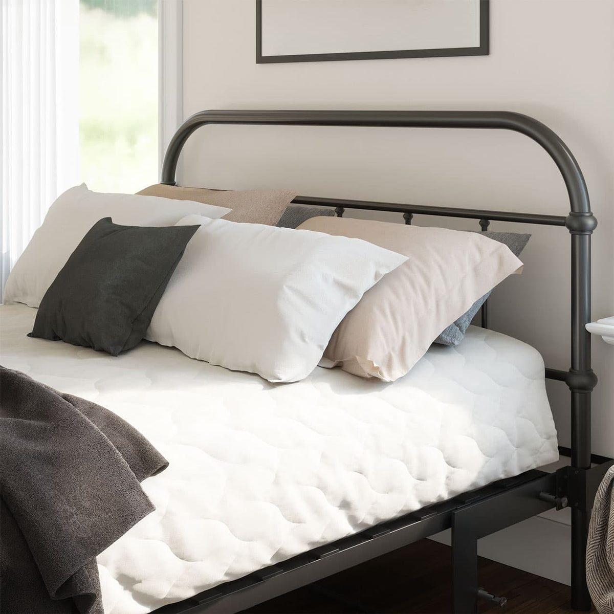 Bed with black metal frame and pillows in a room.
bed frame with headboard footboard lift bed storage lift up bedroom furniture risers space-saving black metal 